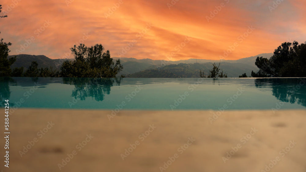 Pool view on sunset nature background.