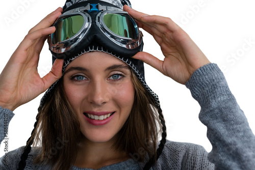 Woman holding ski goggles
