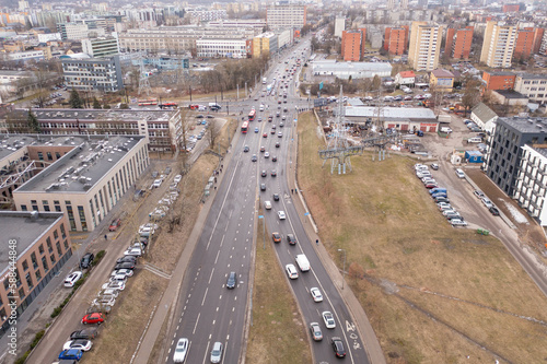 Drone photography of traffic jam in the middle of city during spring morning.