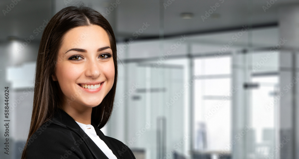 Smiling businesswoman portrait in a modern office Smiling businesswoman portrait in a modern office