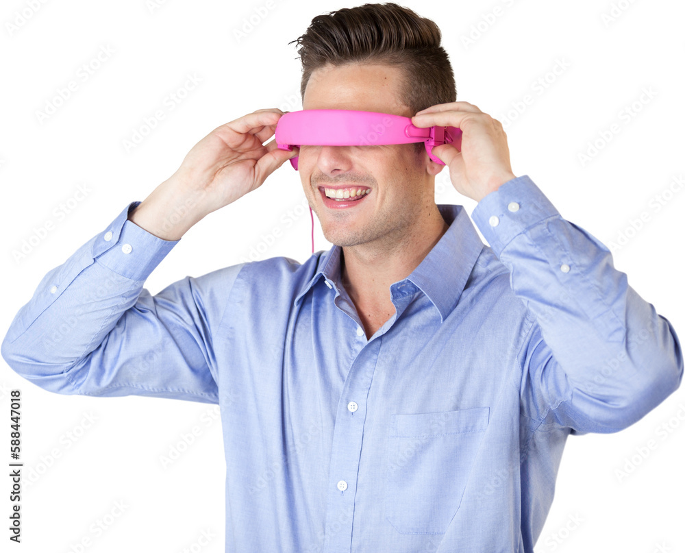 Smiling young man gesturing while using virtual reality glasses Smiling young man gesturing while using virtual reality glasses