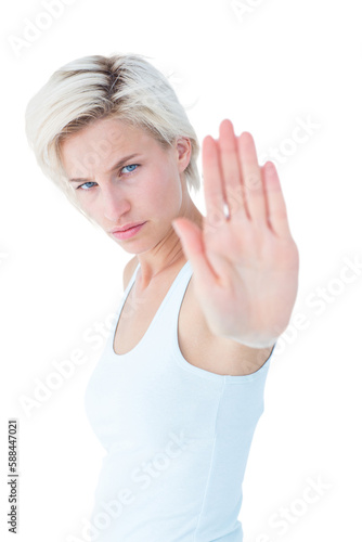 Angry pretty blonde showing her hand 