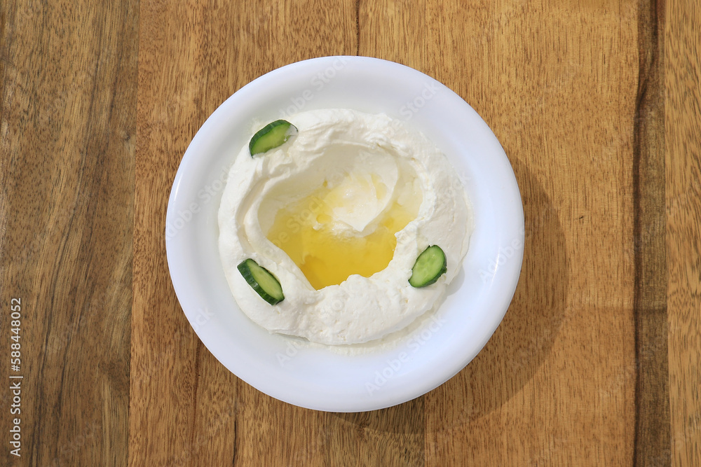 Labneh Plate on Wooden Table Labneh Plate on Wooden Table