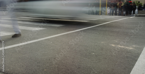 Low section of person crossing road by speeding vehicle © vectorfusionart