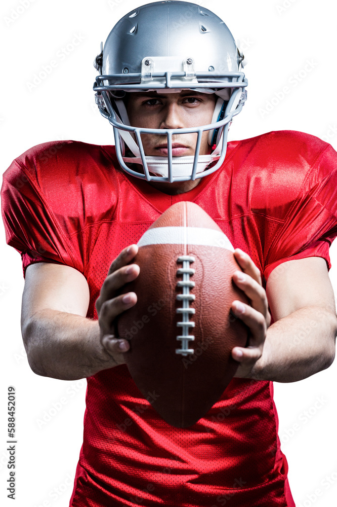 Portrait of determined American football player holding ball Portrait of determined American football player holding ball