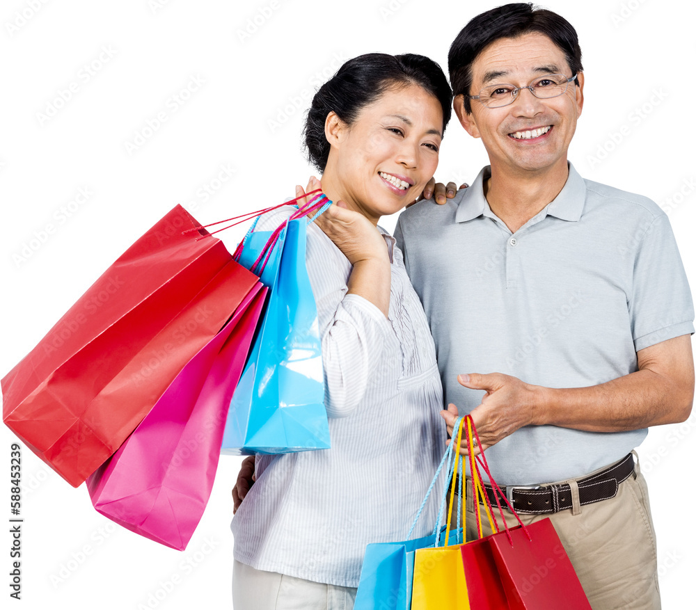 Older asian couple with shopping bags