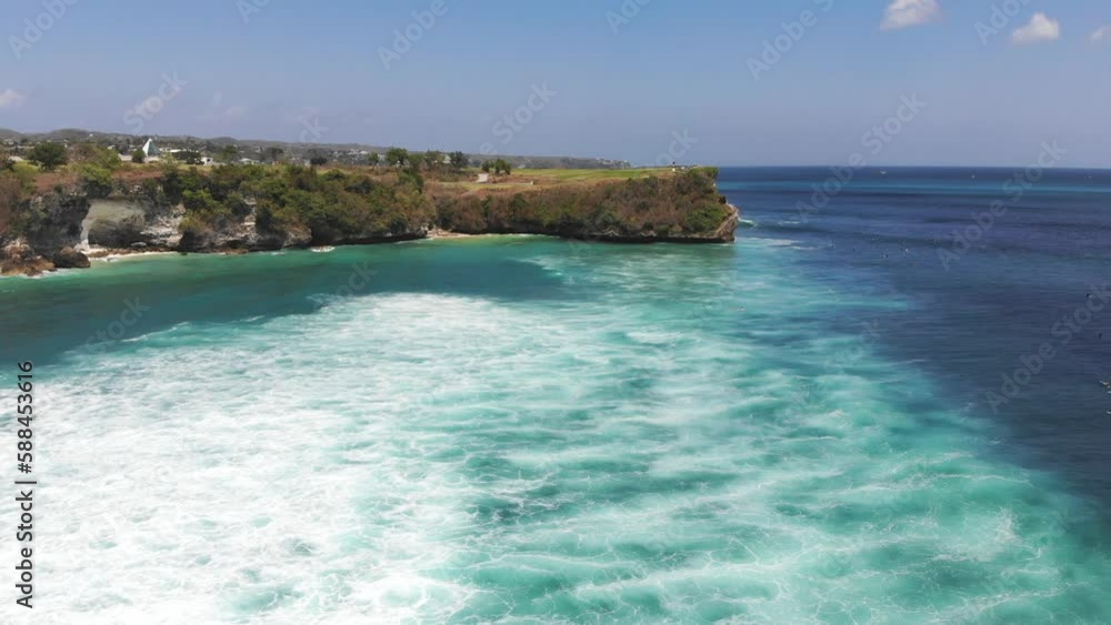 aerial drone view of surfers at beach in Uluwatu Bali aerial drone view of surfers at beach in Uluwatu Bali