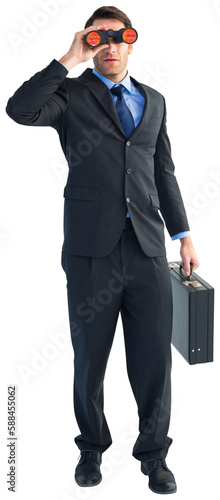 Businessman using binoculars while holding a briefcase