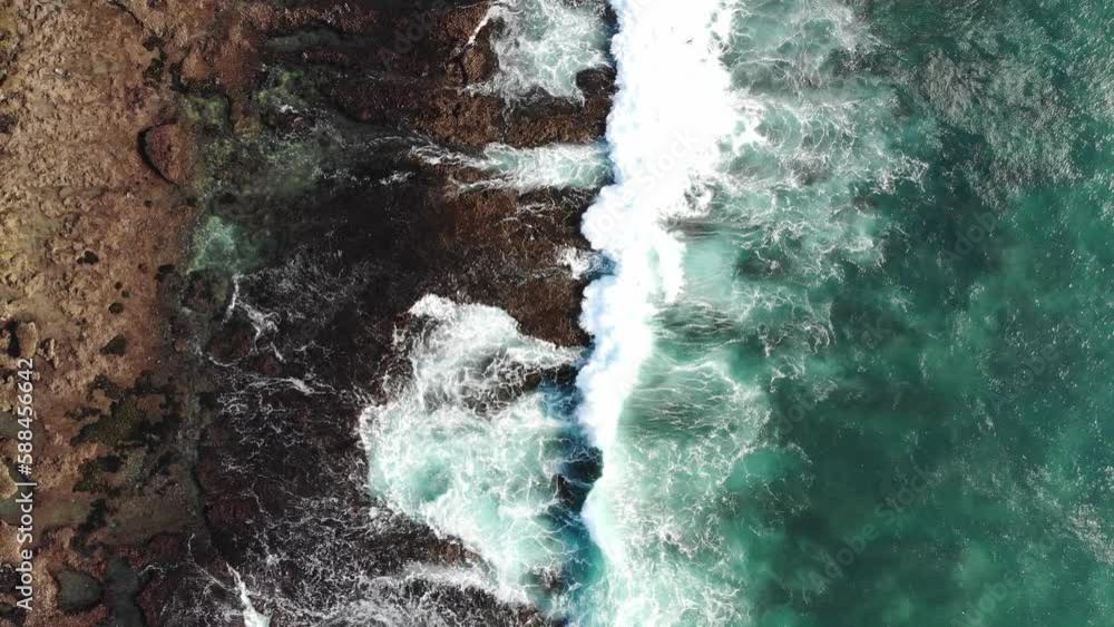 drone fly over rocky beach in Uluwatu Bali during golden hour drone fly over rocky beach in Uluwatu Bali during golden hour