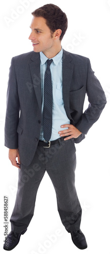 Cheerful businessman standing with hand on hip