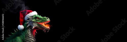 A dragon in a red Santa Claus hat. Year of the Dragon. Dragon isolated on black background. Long Banner with free space