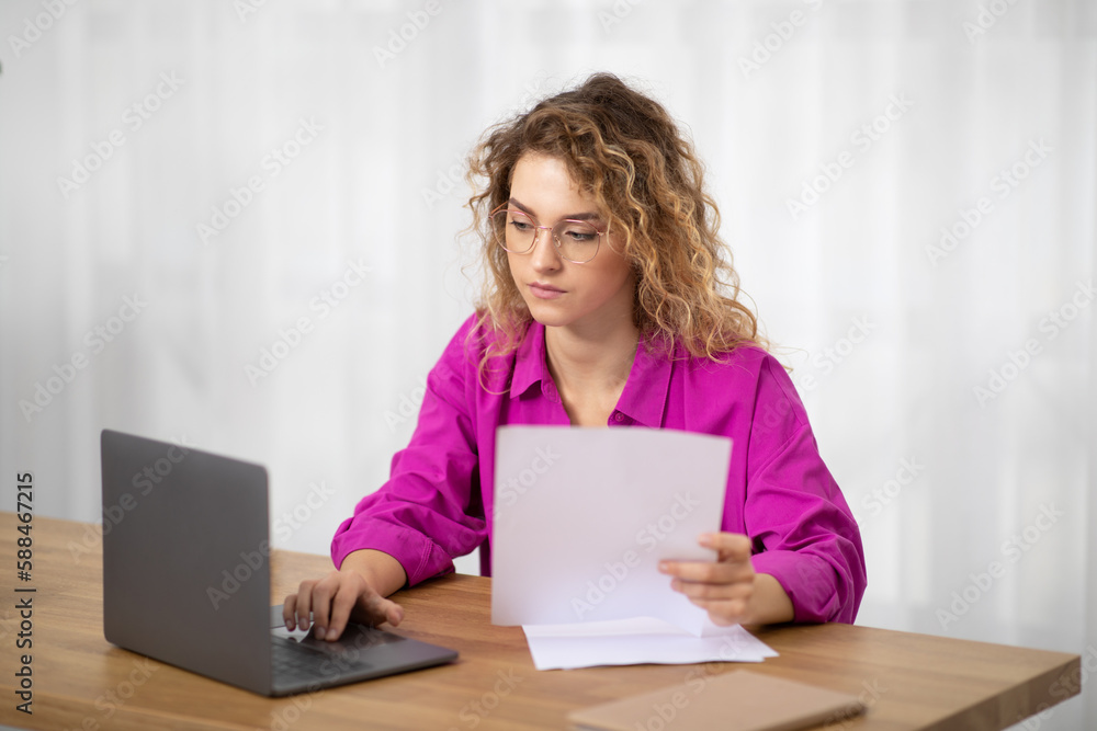 Remote Work. Young Woman Working With Papers And Laptop At Home Office Remote Work. Young Woman Working With Papers And Laptop At Home Office