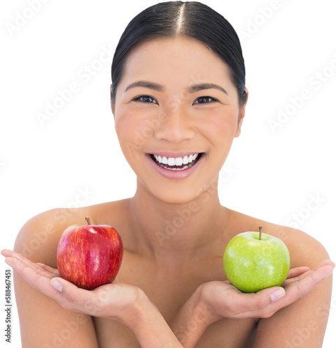 Smiling natural brunette holding apples in both hands