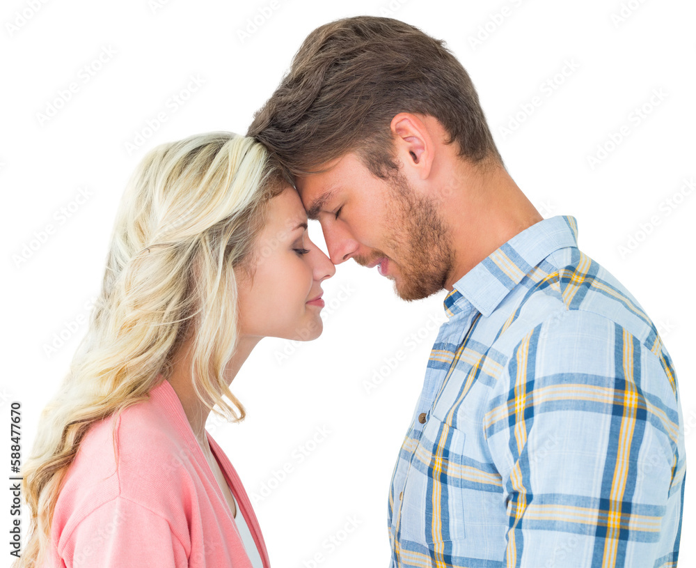 Attractive couple standing touching heads Attractive couple standing touching heads