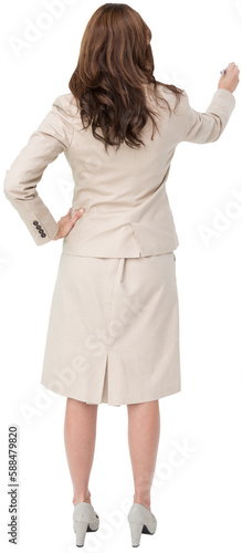 Businesswoman standing back to camera writing with marker
