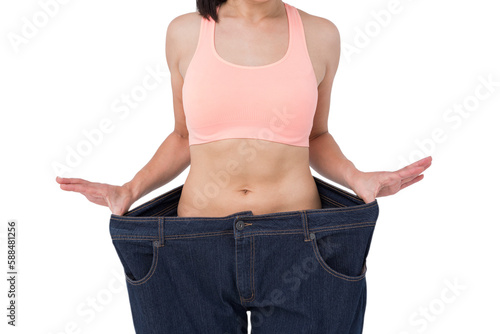Woman showing her waist after losing weight