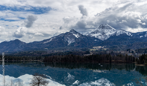 Spring on an Austrian lake Faakersee overlooking the Alps