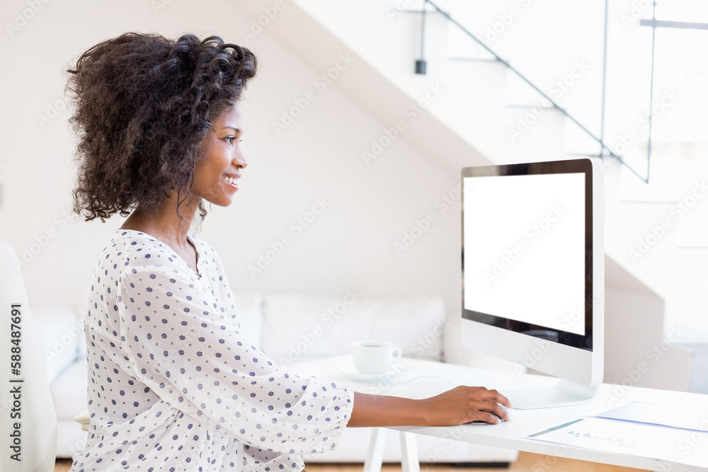 Happy woman using desktop computer Happy woman using desktop computer