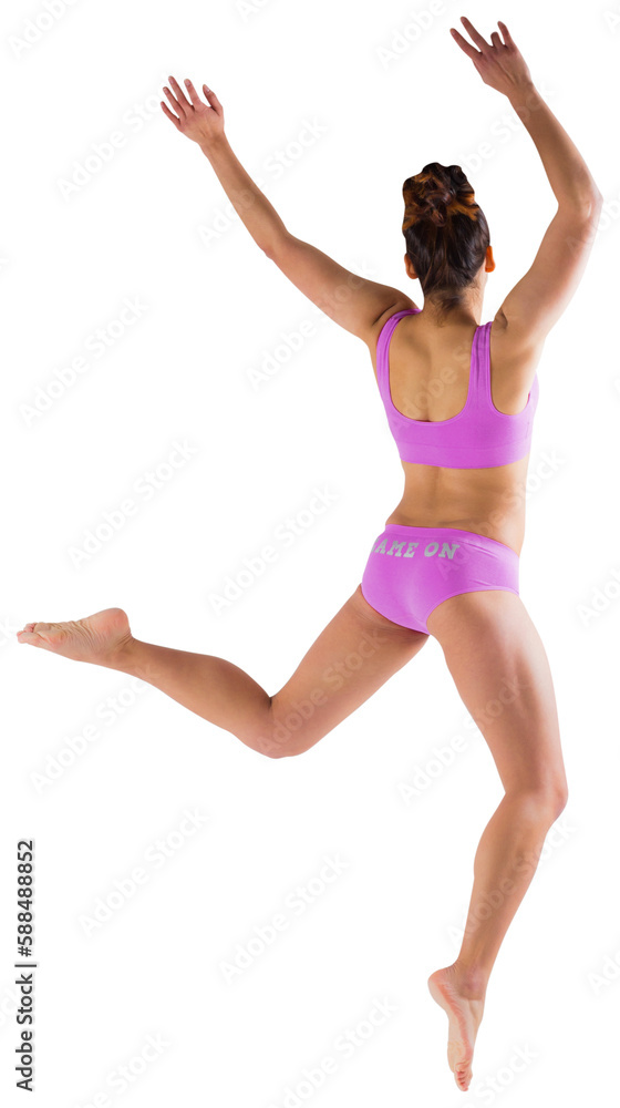 Fit brunette jumping and posing
