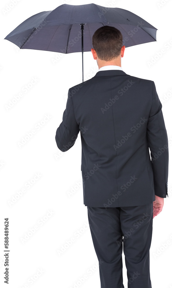 Businessman sheltering under black umbrella Businessman sheltering under black umbrella
