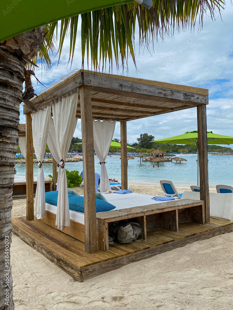 Beach cabanas overlooking the Caribbean Sea. Relax in the shade. Beach
