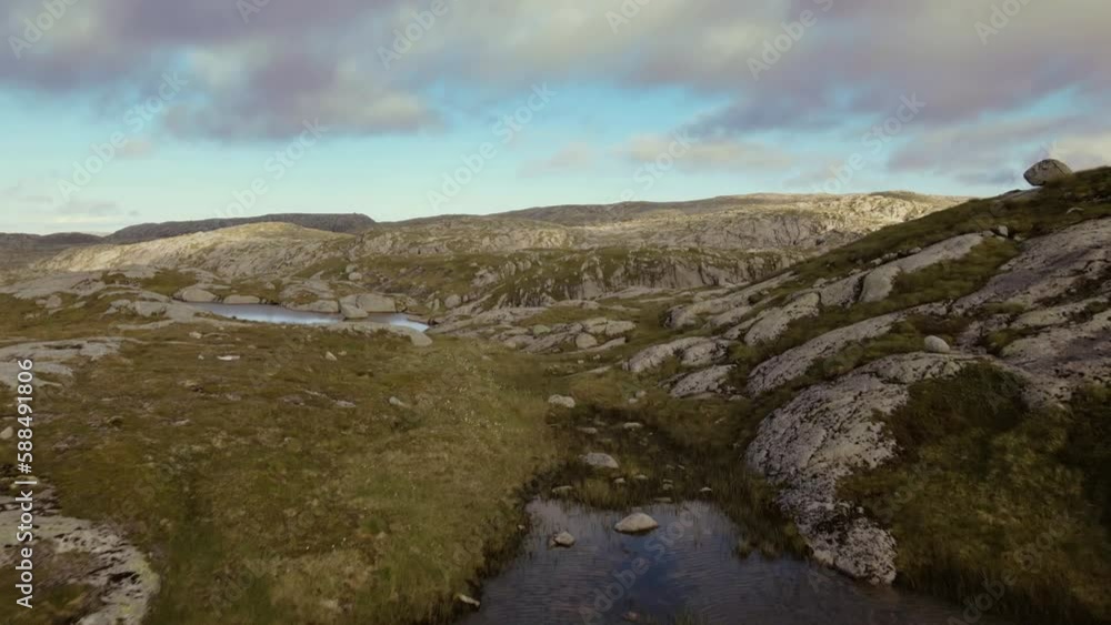 Aerial view of epic landscape moving slowly while floating above glacial lakes and mountain hills. Drone shot of Norway Aerial view of epic landscape moving slowly while floating above glacial lakes and mountain hills. Drone shot of Norway