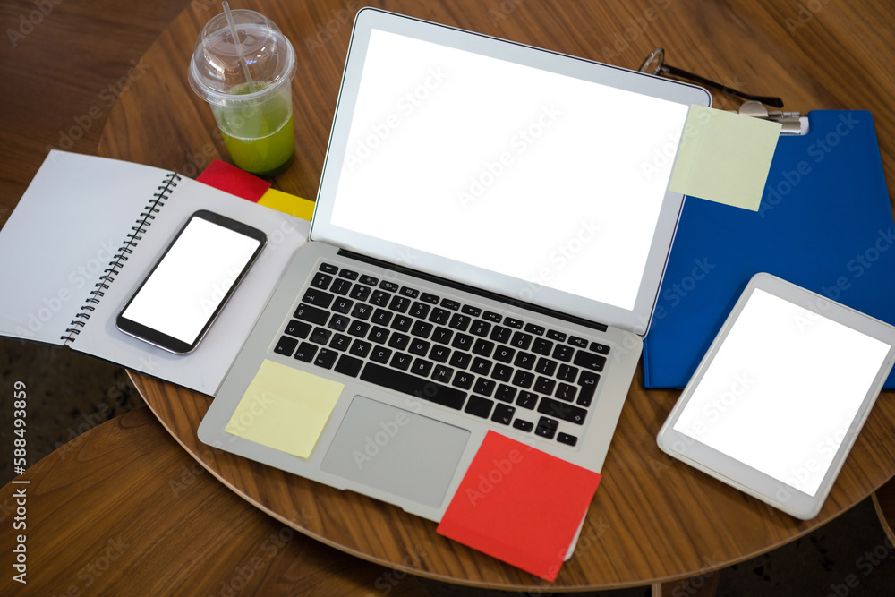 High angle view of laptop and digital tablet on table in office High angle view of laptop and digital tablet on table in office