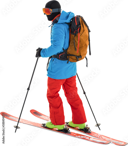Skier with yellow backpack skiing 