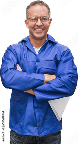 Smiling warehouse manager standing with arms crossed