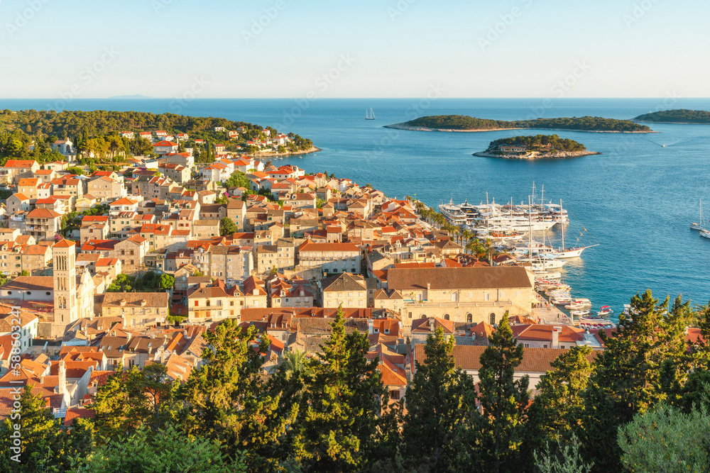 Aerial view of the old town of Hvar with turquoise water bay with yachts and islands in Dalmatia, Croatia and Adriatic sea