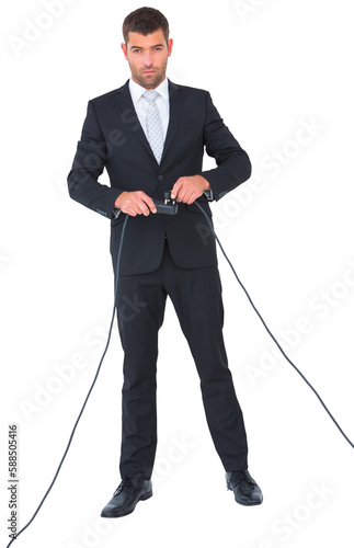 Businessman connecting a plug