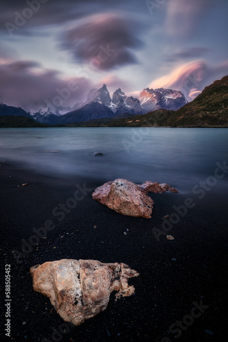 Mountain peak with lenticular clouds  in Patagonia at sunset photo