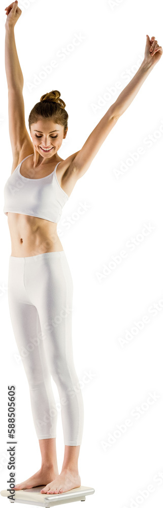 Full length of cheerful slim woman standing on weighing scale Full length of cheerful slim woman standing on weighing scale