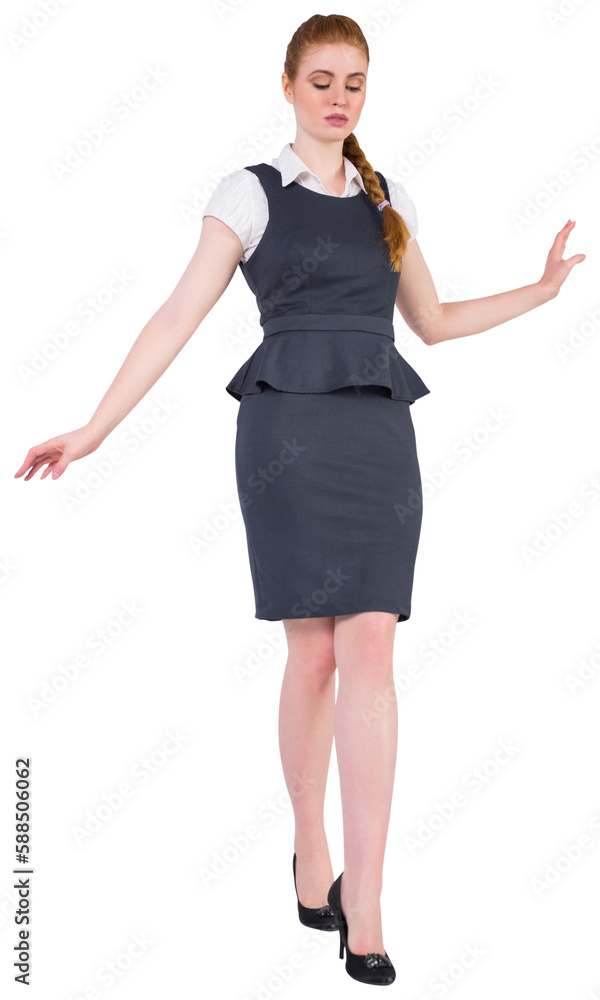 Fototapeta premium Businesswoman doing a balancing act