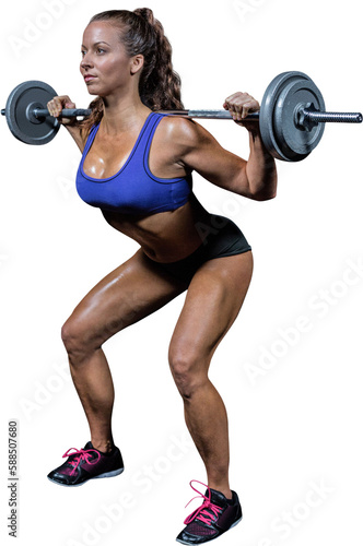 Woman crouching while lifting crossfit