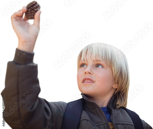 Boy holding pine cone