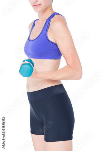 Attractive woman in sportswear lifting dumbbell 