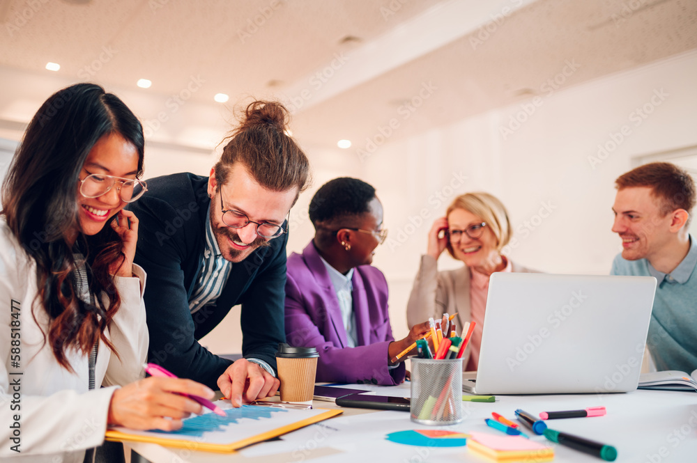 Multiracial business group of people having a meeting in an office Multiracial business group of people having a meeting in an office