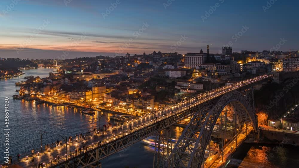 Dusk to night timelapse view of Porto cityscape and Dom Luis I Bridge over the Douro River in Porto (Oporto), Portugal, zoom in. Dusk to night timelapse view of Porto cityscape and Dom Luis I Bridge over the Douro River in Porto (Oporto), Portugal, zoom in.