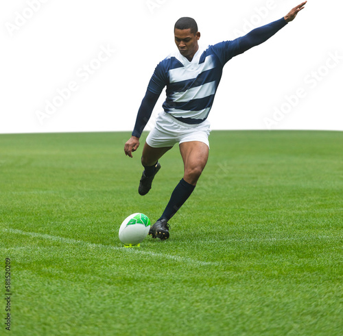Male rugby player kicking the ball