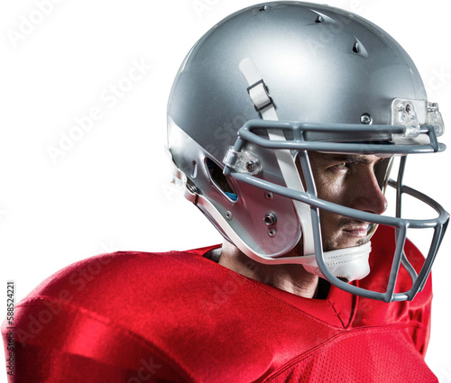 Confident American football player in red jersey looking away