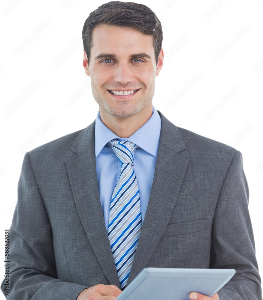 Businessman using a tablet with colleagues behind in office Businessman using a tablet with colleagues behind in office