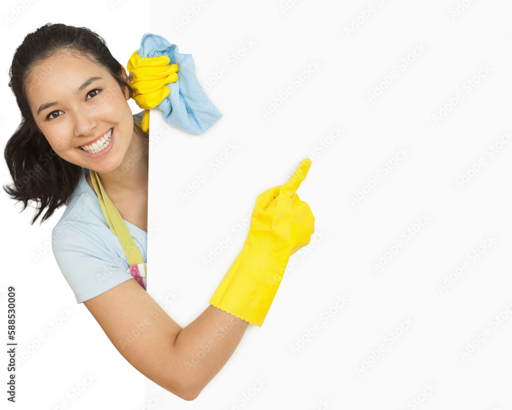 Woman in rubber gloves pointing to the white surface Woman in rubber gloves pointing to the white surface
