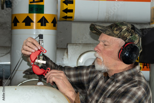 worker applying valve lockout