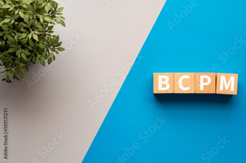 There is wood cubes with the word BCPM. It is an abbreviation for Business Continuity Plan Management as eye-catching image. photo