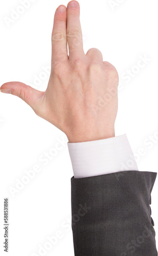 Hand of businessman showing finger gun