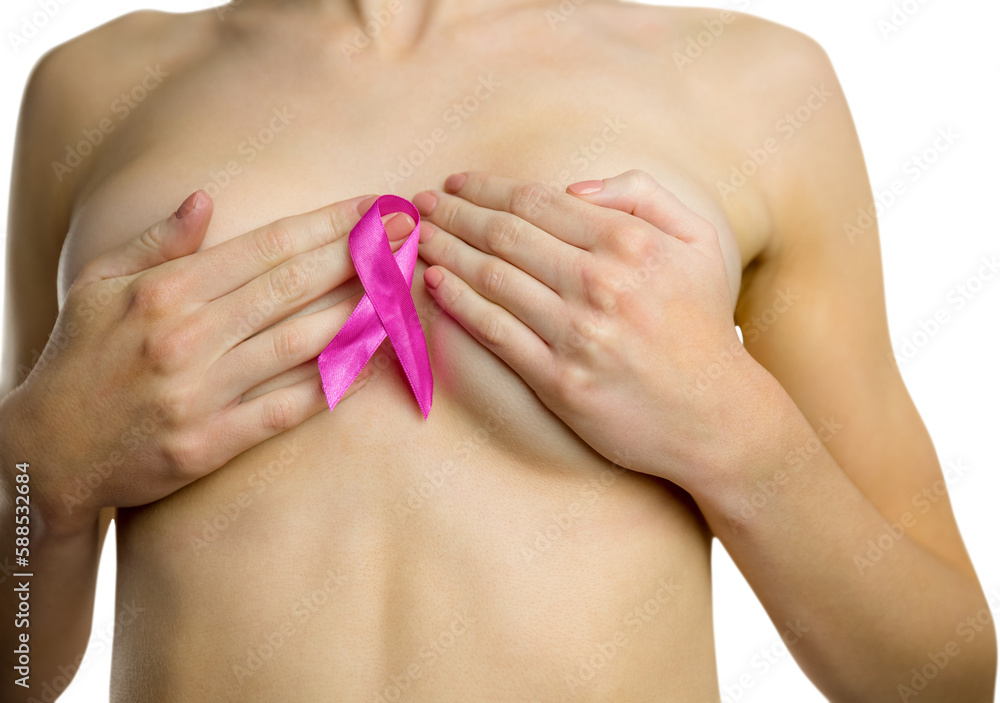 Fototapeta premium Midsection of naked woman with pink ribbon covering breast
