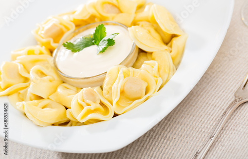 Boiled ravioli with mayonnaise. High quality photo