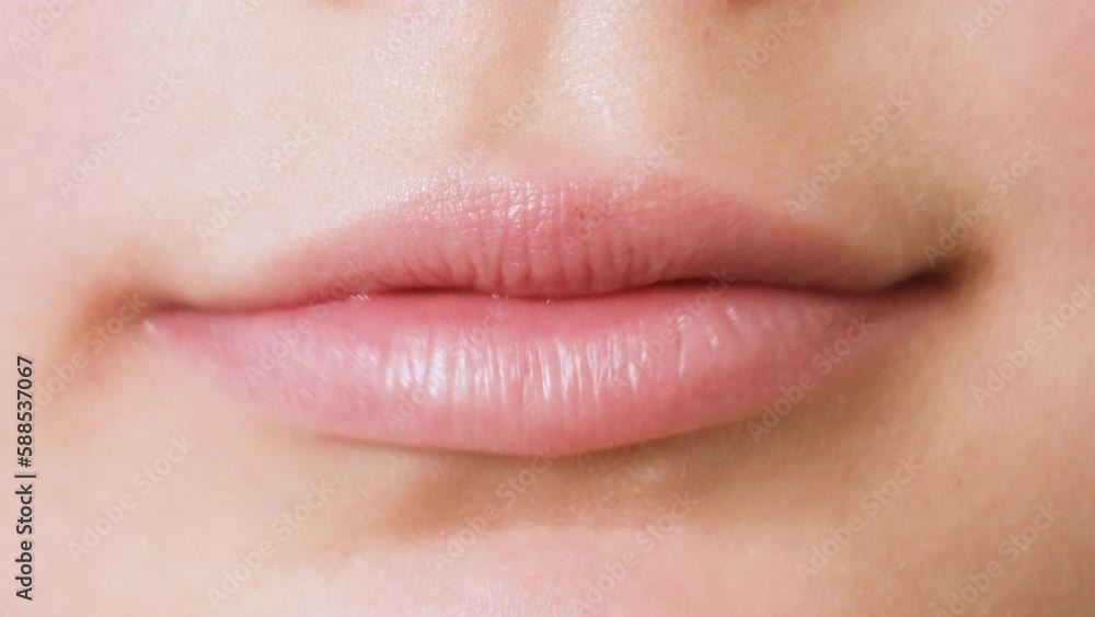 Child girl or girl of seven years old showing her teeth to the dentist. Concept of orthodontics, dental health, braces