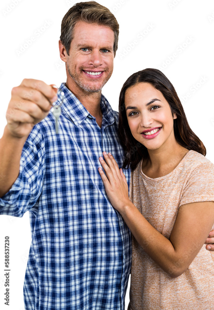 Portrait of happy couple holding home keys Portrait of happy couple holding home keys